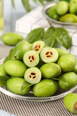 Fresh Green Olives with Basil Leaves in Glass Bowl - Mediterranean Kitchen Scene
