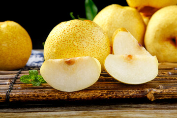 Fresh White Crown Pears with Slices on Rustic Wood - Premium Dangshan Variety Fruit Display