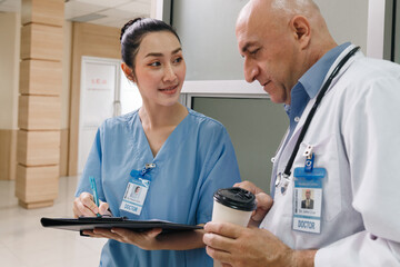 professor doctor give advice and discuss with intern student for surgery planning and patient...