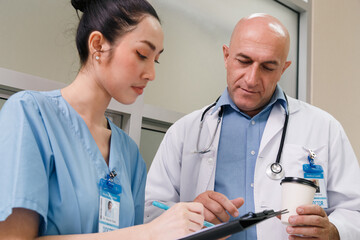 professor doctor give advice and discuss with intern student for surgery planning and patient...