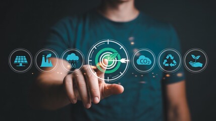 Man interacts with digital icons representing sustainability and environmental goals