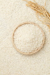 Fresh white rice in bamboo bowl with wheat stalks - Asian cuisine ingredient flat lay