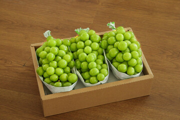 Fresh Green Seedless Grapes in Wooden Carrying Case with Paper Packaging