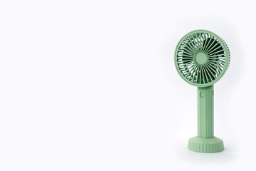 pocket fan, portable fan, mini fan, compact fan, handheld fan, green fan, USB fan, travel accessory, summer gadget, cooling device, desk fan, personal fan, small electric fan, household item, air circ