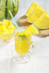 Fresh Yellow Watermelon Juice from Hainan Province with Mint and Cut Fruit Pieces