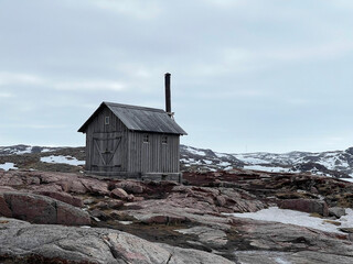 A lonely hut in the tundra on the shore of the Barents Sea, Russia