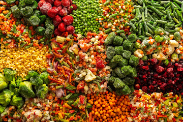 A vivid display of frozen fruits and vegetables in a colorful arrangement, illustrating the process of preserving healthy, seasonal produce for winter, promoting a healthy diet