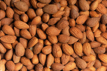 Background y Close up de almendras orgánicas cafés, con textura Clara