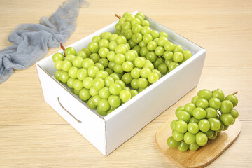 Fresh Green Grapes in White Wooden Box on Light Wood Background - Healthy Fruit Display