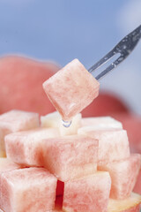 Fresh Sweet Peach Cubes on Fork - Crisp Fruit Pieces Ready to Eat