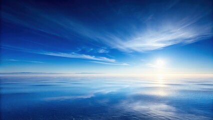 Serene Waterscape A Breathtaking Panorama of a Calm Ocean Under a Vivid Blue Sky with Wispy Clouds and a Radiant Sun