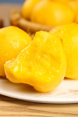 Fresh Golden Nectarine Halves with Shimmering Juices on White Plate - Ripe Summer Stone Fruit