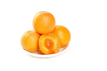 Fresh Apricots from Shandong China - Organic Stone Fruit on White Plate with Cut Half Showing Juicy Orange Interior