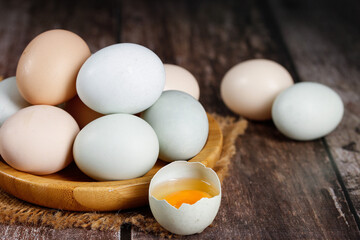Fresh Farm Eggs Naturally Raised in Countryside on Rustic Wooden Table
