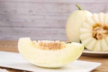 Fresh White Melon Slices on Wood Cutting Board - Healthy Organic Fruit
