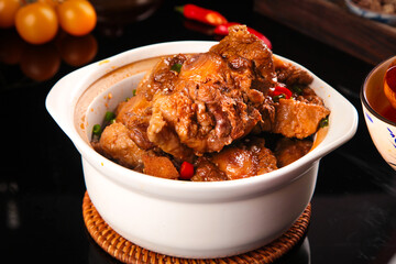 Spicy beef tail stew with fresh vegetables in ceramic bowl - traditional comfort food dish
