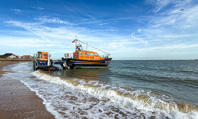 Lifeboat on rotating Beach Recovery and Launch Tractor Trailer