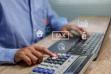 Businessman using calculator and laptop with tax digital interface,Concepts for online tax filing management, online payment financial planning income report system personal account finance