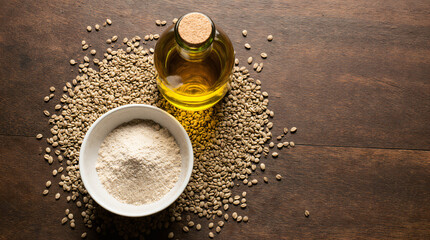 Hemp Flour and Seeds with Oil on Rustic Wooden Table