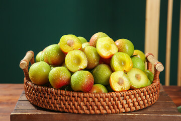 Fresh Red and Green Plums in Wicker Basket - Organic Stone Fruit Harvest Display