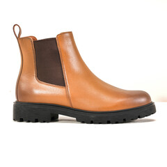 Elegant brown leather Chelsea boot with black sole isolated on white background, perfect for men’s casual and formal wear.
 durable and versatile footwear design for fashion and lifestyle projects.