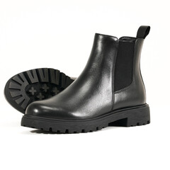 Elegant black leather Chelsea boot with black sole isolated on white background, perfect for men’s casual and formal wear.
 durable and versatile footwear design for fashion and lifestyle projects.