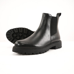 Elegant black leather Chelsea boot with black sole isolated on white background, perfect for men’s casual and formal wear.
 durable and versatile footwear design for fashion and lifestyle projects.