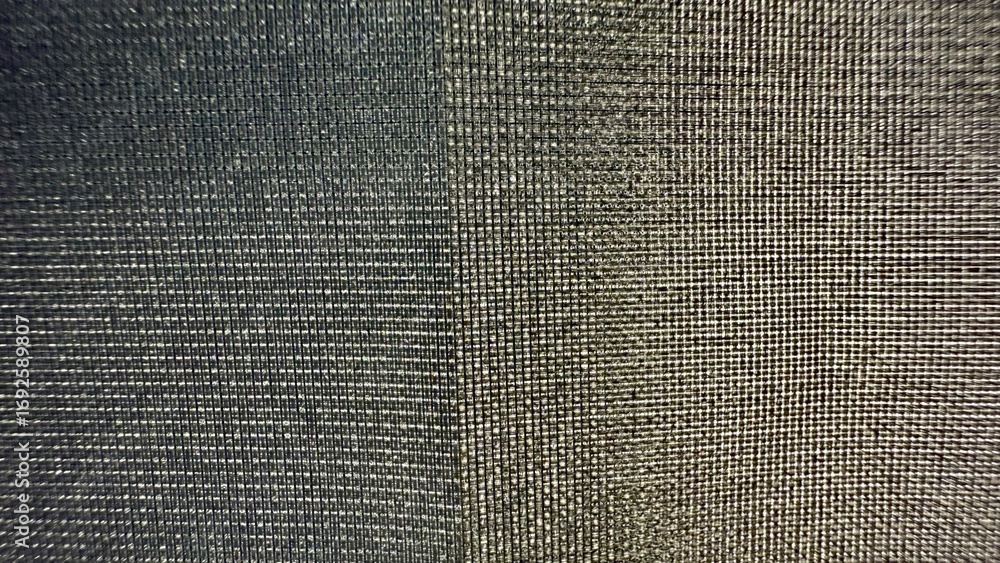 Poster metallic mesh fabric texture with shimmering grid pattern and subtle light reflection ideal for mode