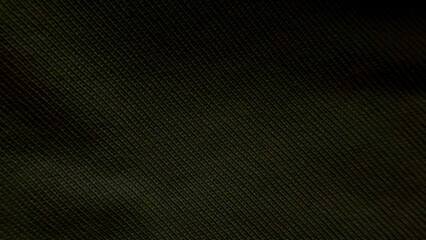 olive green textile closeup with fine diagonal weave texture creating dark tonal depth for modern wallpaper or banner background