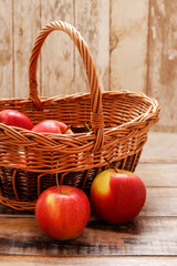 Red apples in wicker basket.