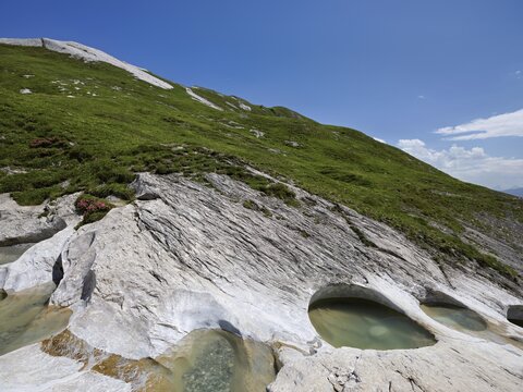 Glacier mill with glacier pots on the Trinser Alp Mora, Trin, Canton Graub&uuml;nden, Switzerland