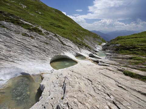 Glacier mill with glacier pots on the Trinser Alp Mora, Trin, Canton Graub&uuml;nden, Switzerland