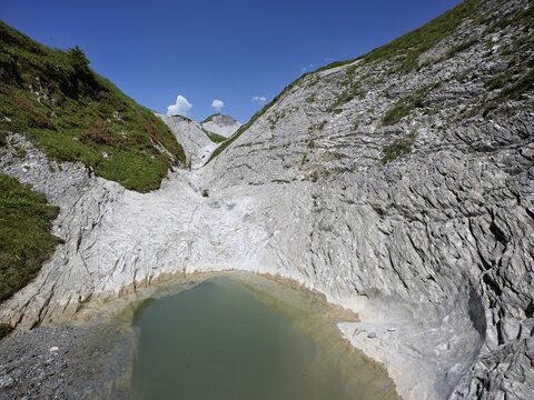 Glacier mill with glacier pots on the Trinser Alp Mora, Trin, Canton Graub&uuml;nden, Switzerland