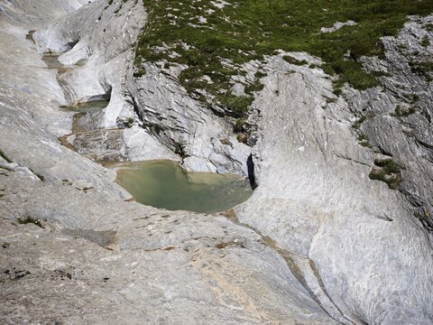 Glacier mill with glacier pots on the Trinser Alp Mora, Trin, Canton Graub&uuml;nden, Switzerland