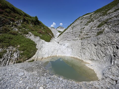 Glacier mill with glacier pots on the Trinser Alp Mora, Trin, Canton Graub&uuml;nden, Switzerland