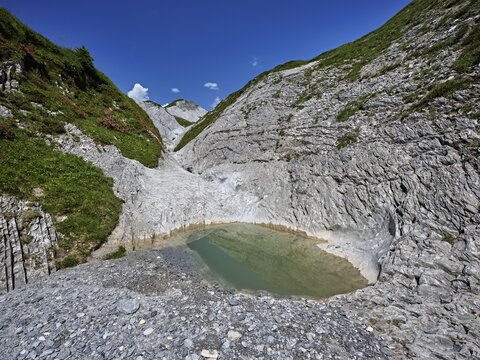 Glacier mill with glacier pots on the Trinser Alp Mora, Trin, Canton Graub&uuml;nden, Switzerland