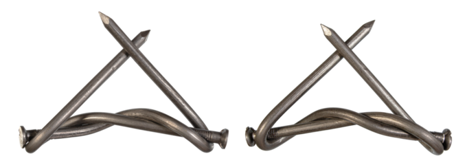 Unique handmade metal art piece featuring twisted nails and straight pins created in a workshop setting