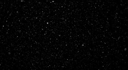 Falling snow against a black background