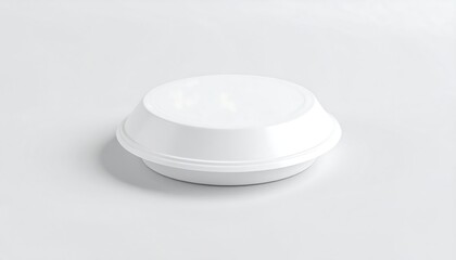 A round, white disposable food container, slightly domed