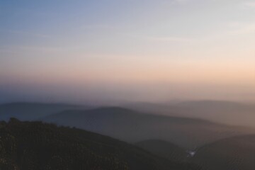 Misty Mountains Sunrise Over Rolling Hills Landscape