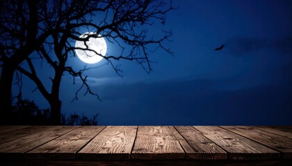 An eerie Halloween night with a silhouette of trees against an orange sky and a full moon