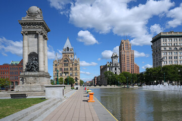 Clinton Square in Syracuse, New York State, with a civil war memorial monument and surrounded by well preserved buildings from the early to mid 1800s