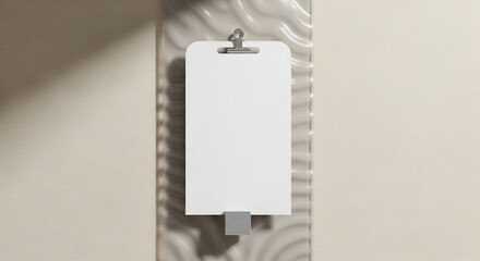 Blank White Clipboard Hanging on a Textured Surface with Natural Light