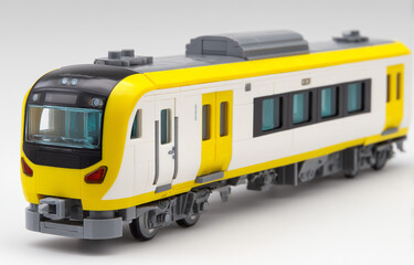 Toy train model isolated on white background, a miniature passenger vehicle