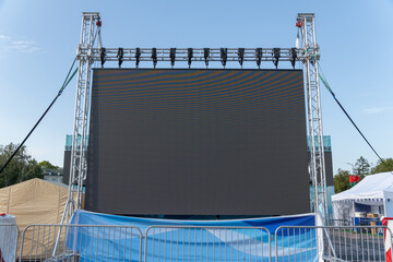 Large LED screen displaying stage performance
