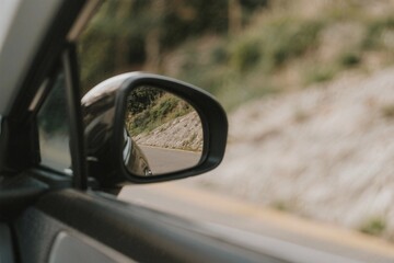 Looking Back While Driving on a Scenic Road