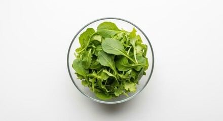 Fototapeta premium Fresh Salad Greens Delightfully Arranged in a Glass Bowl, Creating a Visually Appealing and Healthy Dish