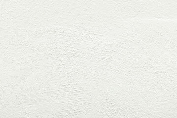 Close-up macro white concrete wall detail texture,Close-up view of a textured white concrete wall, highlighting the interplay of light and shadow on its uneven surface.