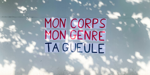 Protest poster pasted by members of a french feminist movement saying "my body, my gender, shut up"