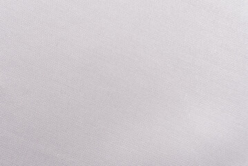 Texture of dense white fabric for tailoring. Canvas. Textile. Material